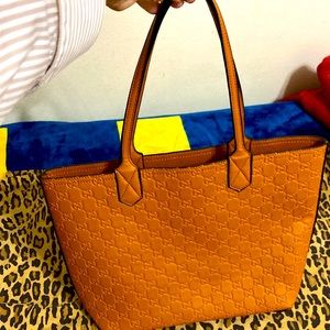 Designer fake Tote. Rust brown